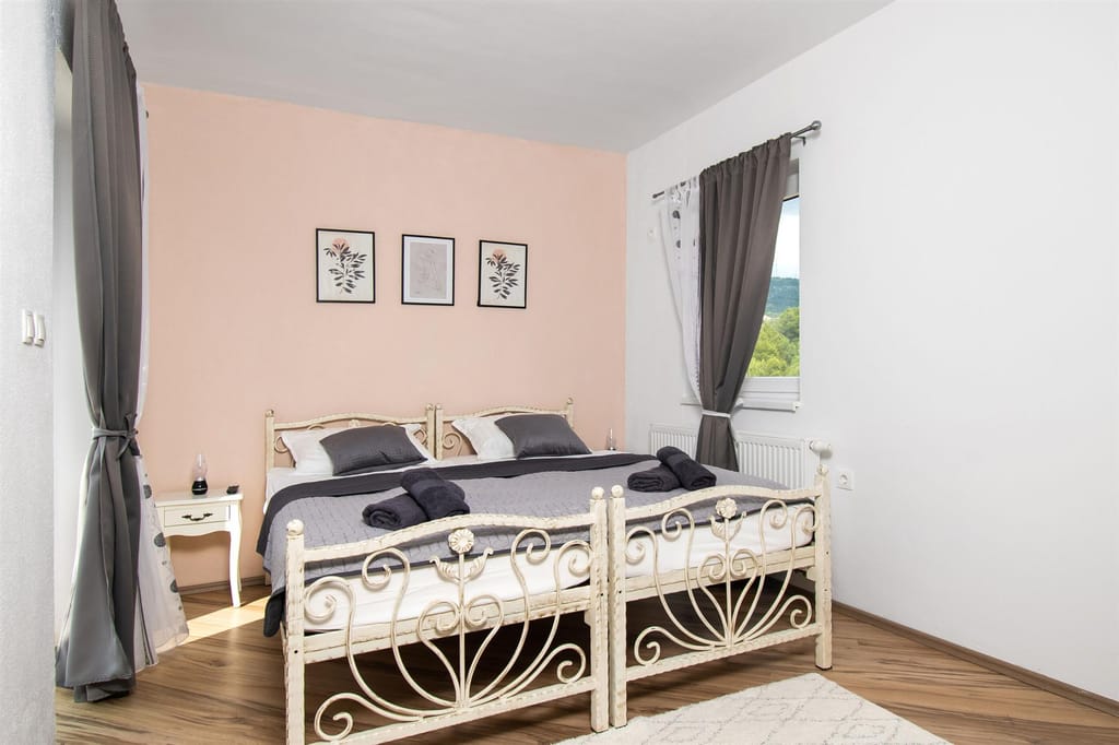 Twin bedroom with two wrought-iron single beds